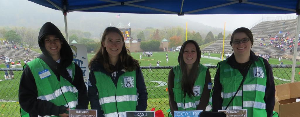 Game Day Green team in front of recycling booth inside Goodman Stadium 